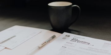 tax documents and mugs