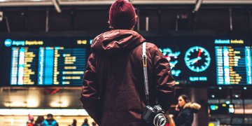 traveler in airport with camera